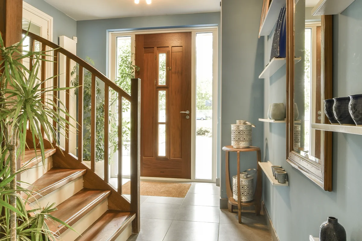 Modern home entrance featuring professional entryway remodeling ideas in Saint Lucie County with custom lighting and a premium front door upgrade.